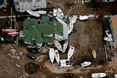 Op de foto: De schade die Sandy op 31 oktober 2012 veroorzaakte in Sea Bright New-Jersey. De foto is gemaakt door Mario Tama van Getty Images